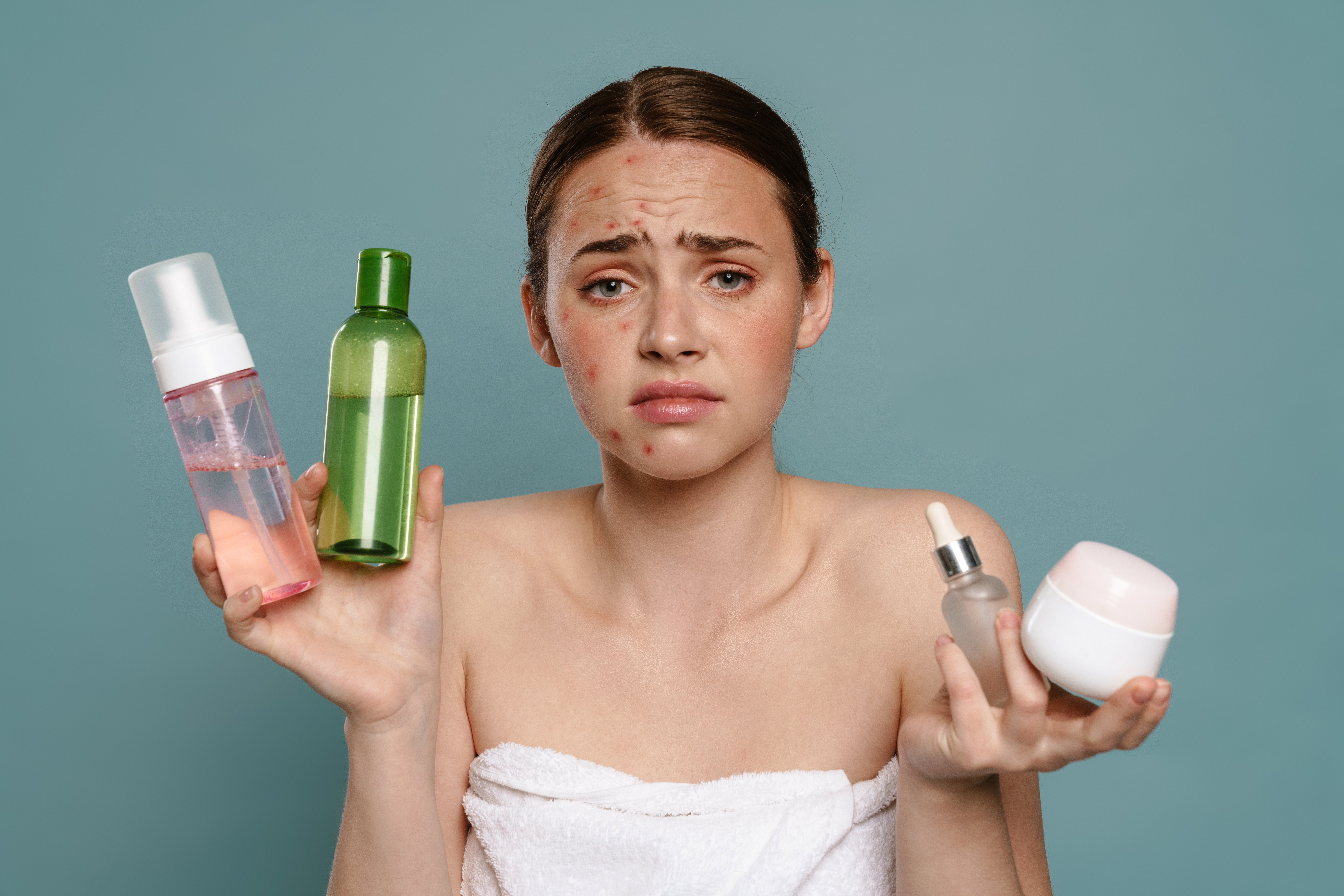 1woman-holds-skin-care-products-with-sad-expression-2026-03-20-02-25-51-utc